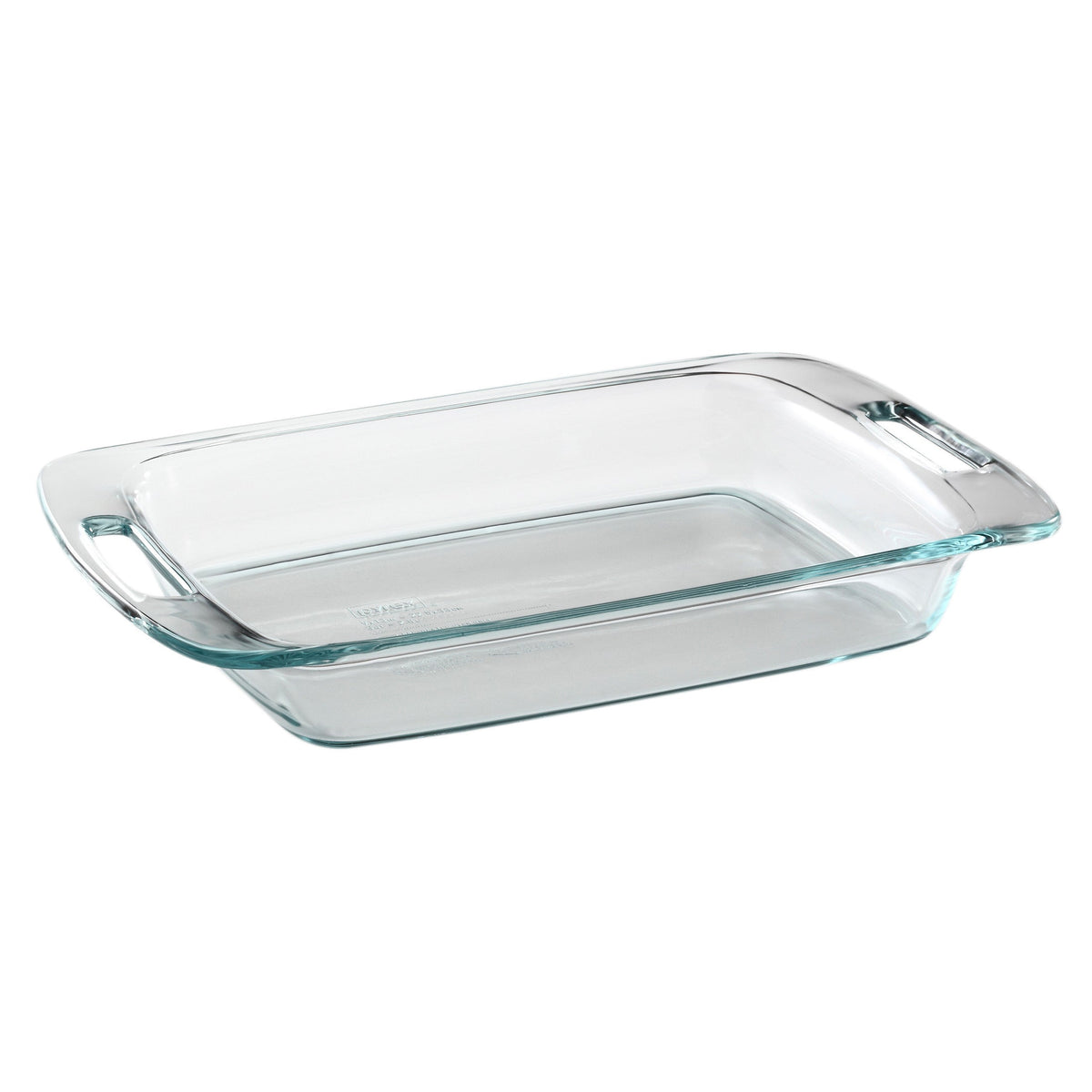 Clear glass baking dish with handles on a white background