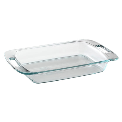 Clear glass baking dish with handles on a white background