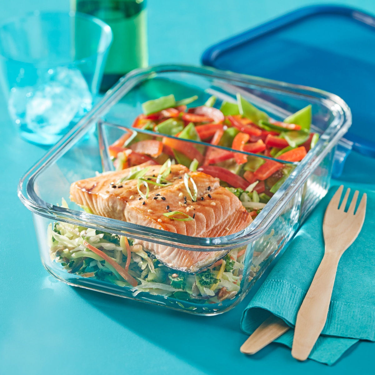 MealBox 5.8-cup Divided Glass Food Storage Container with food inside on the table