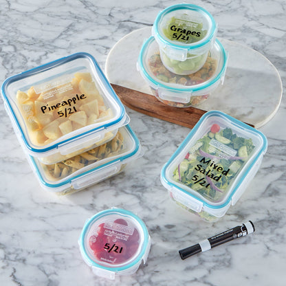 Containers with labeled lids on a marble surface, featuring text about writeable and erasable lids.