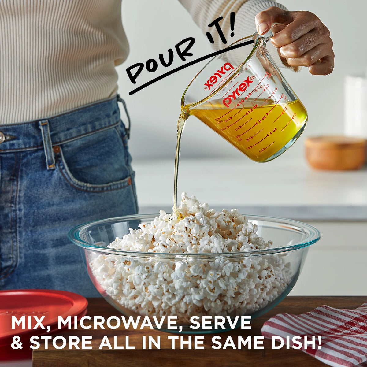 Glass Prep showng butter being poured from measuring cup over popcorn in bowl text mix,microwave &amp; store in all the same dish