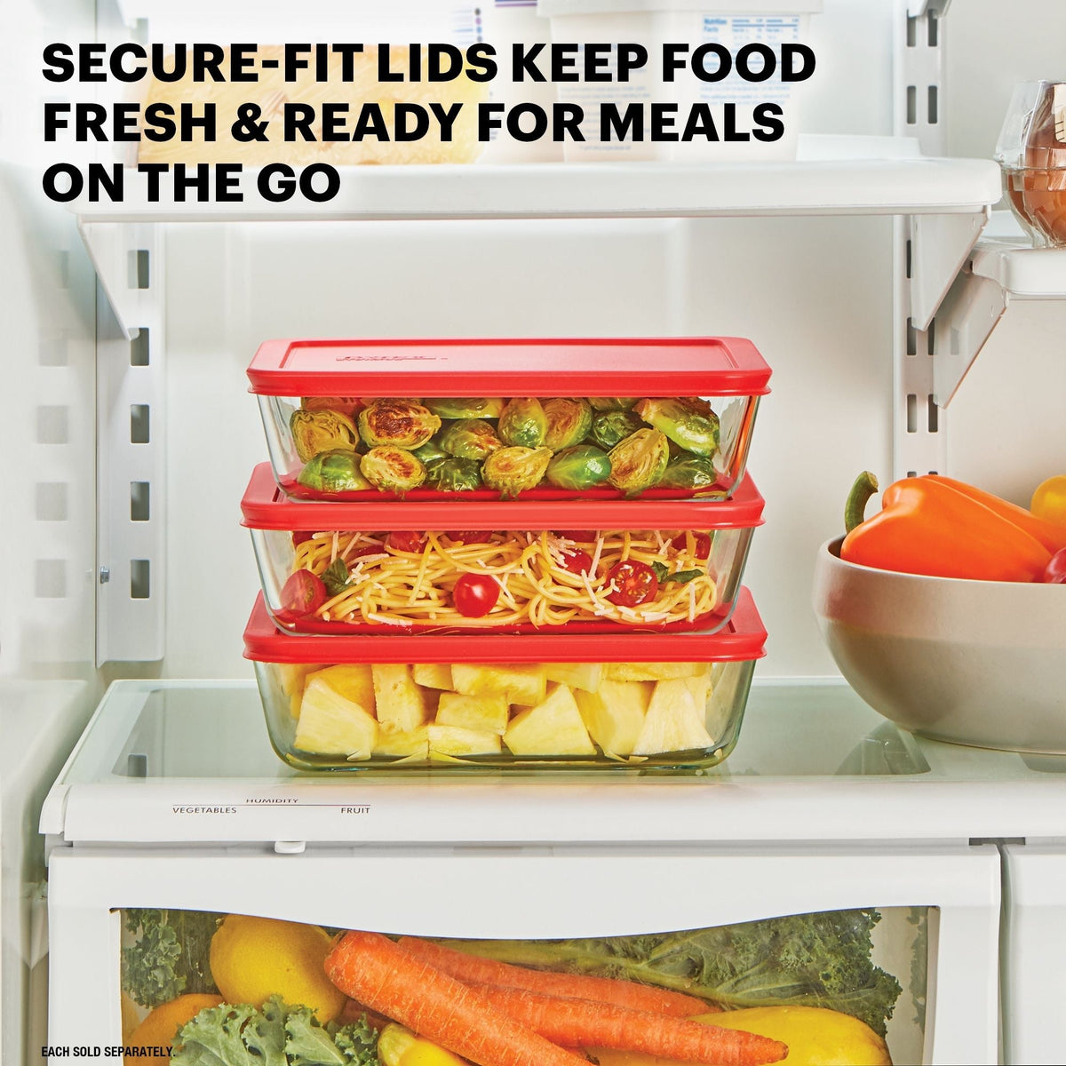 Glass food containers with red lids on a kitchen shelf, containing various foods.