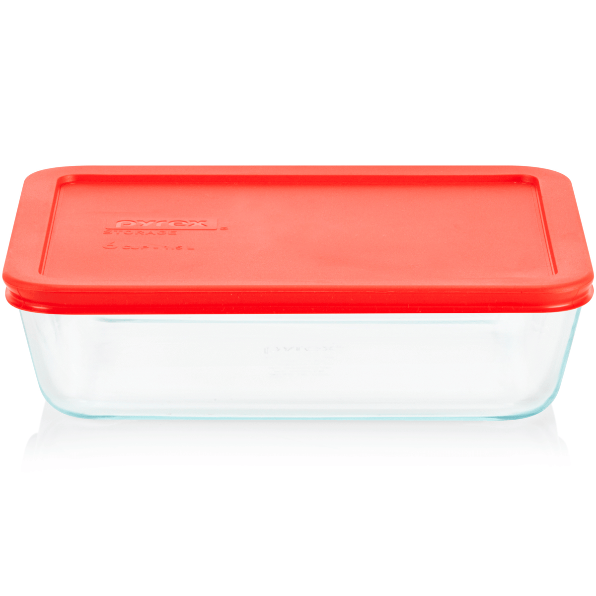 Clear glass food storage container with a red lid on a white background