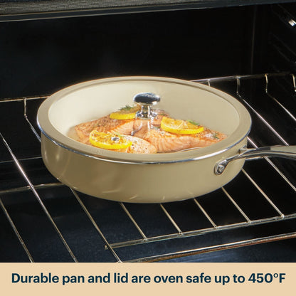 Ceramic cookware with lid containing salmon dish inside an oven.