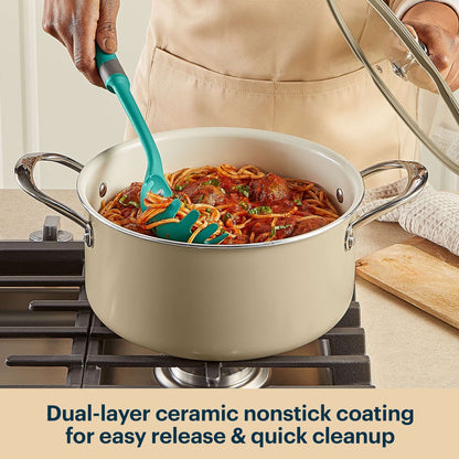 Person cooking spaghetti with meatballs in a pot on a stove, using a green spatula.