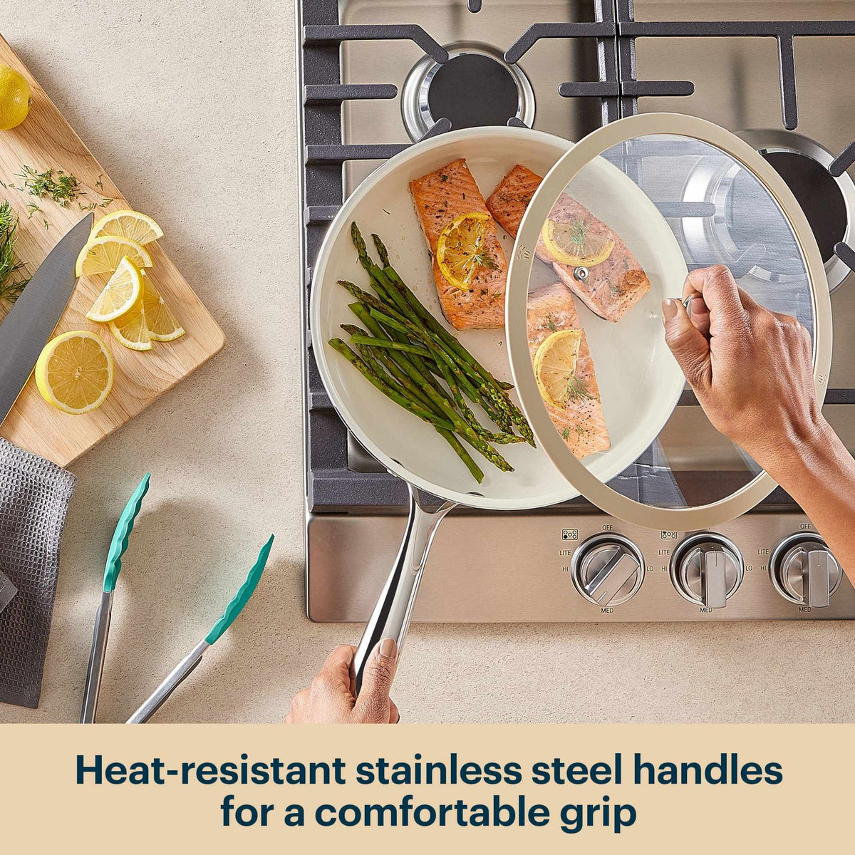 Person holding a pan with food on a stove, with text about heat-resistant stainless steel handles.