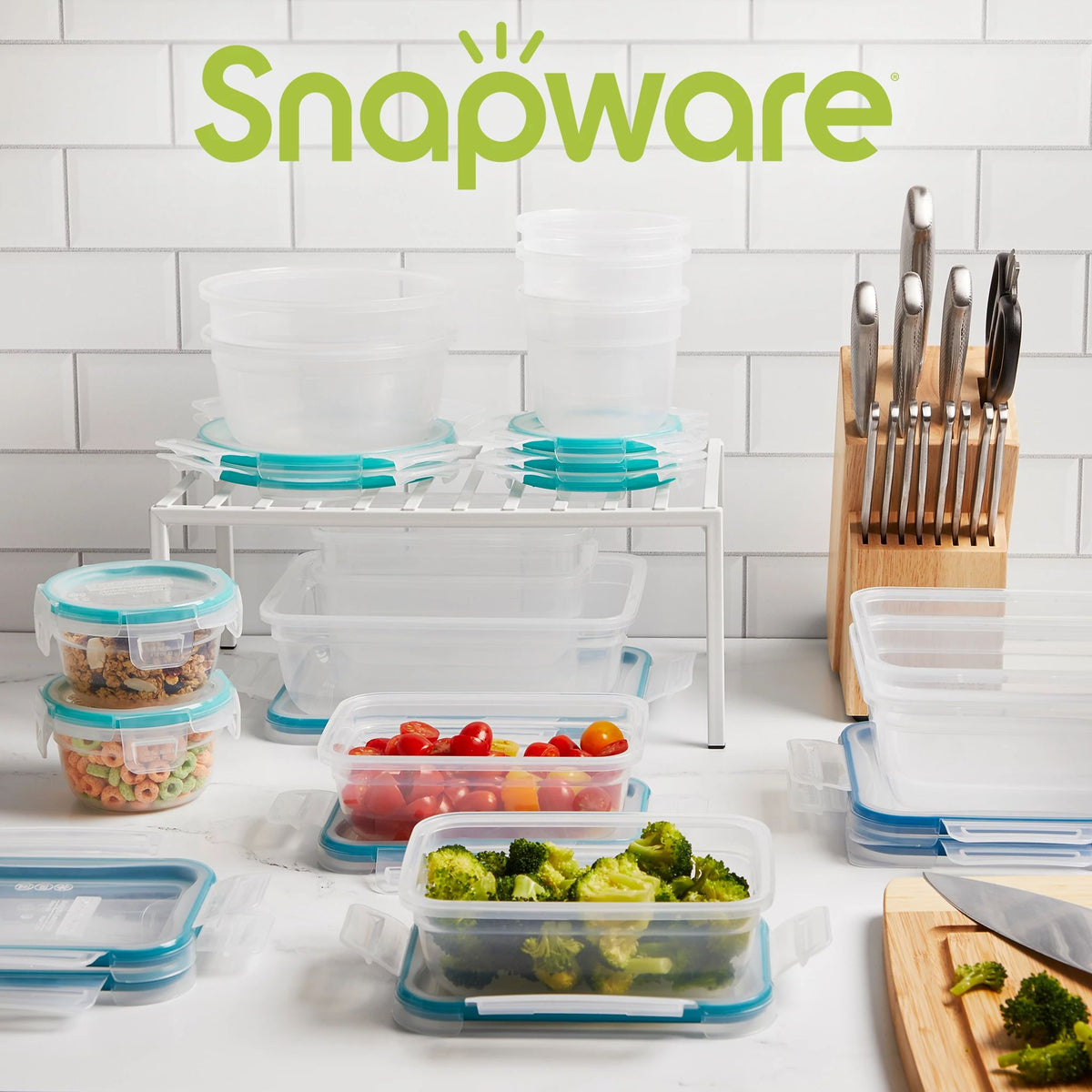 Total Solution 28-piece Plastic Storage Set on counter with food