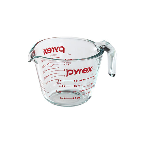 Pyrex measuring cup on a white background