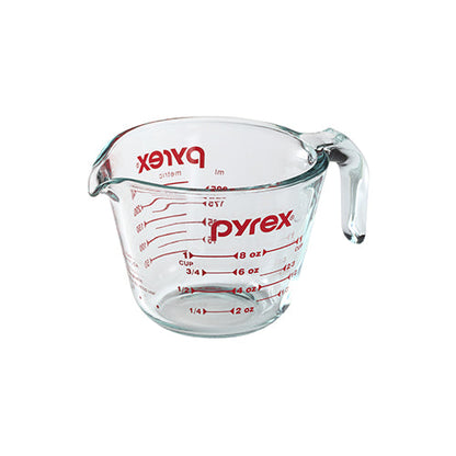 Pyrex measuring cup on a white background
