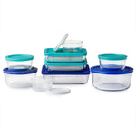 Set of clear food storage containers with blue lids on a white background