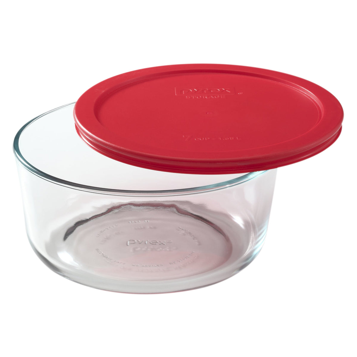 Clear glass food storage container with a red lid on a white background